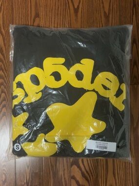 Black Spider Hoodie with Bold Yellow Star Graphic
